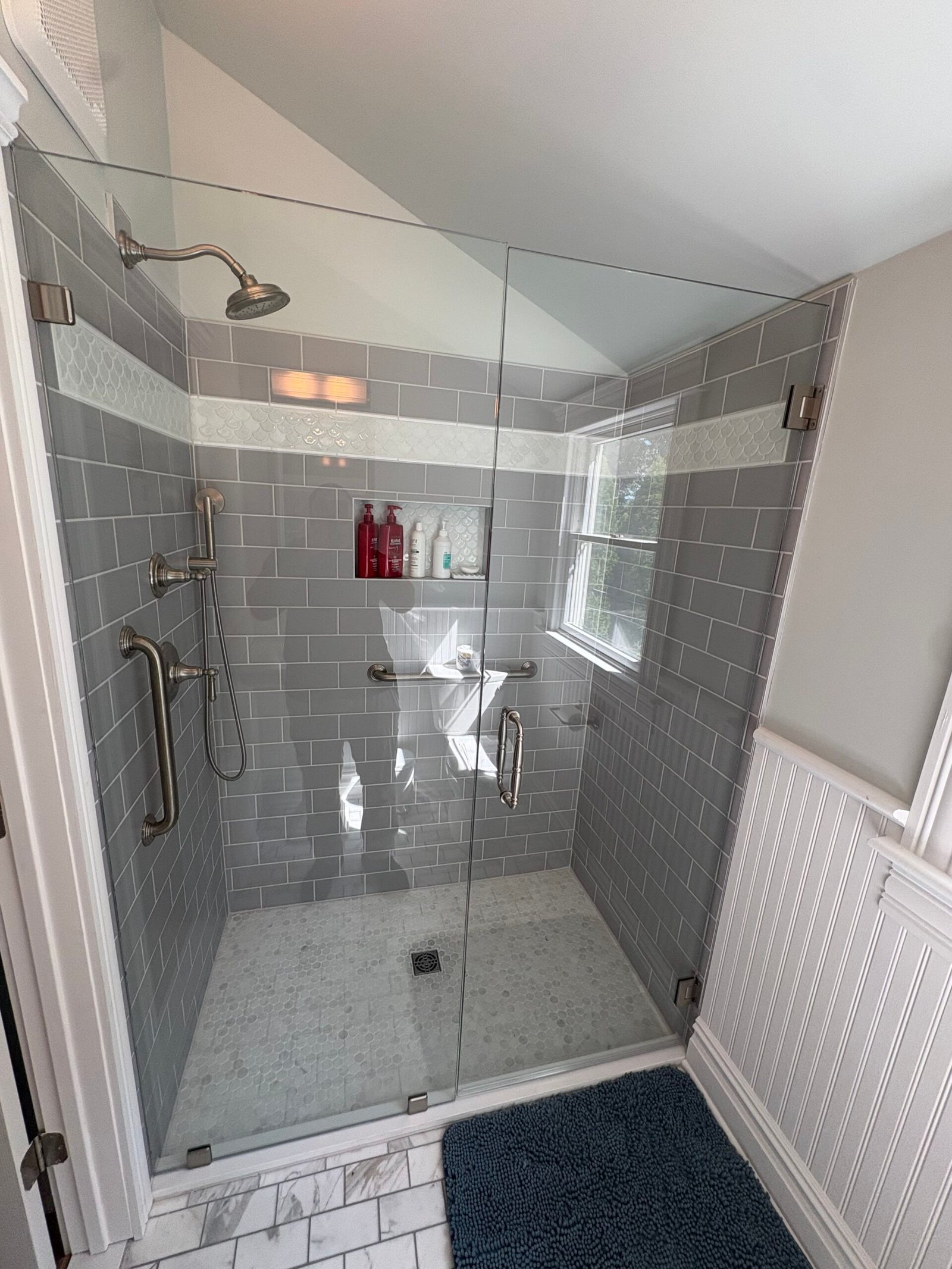 the bathtub-to-shower conversion — after renovation