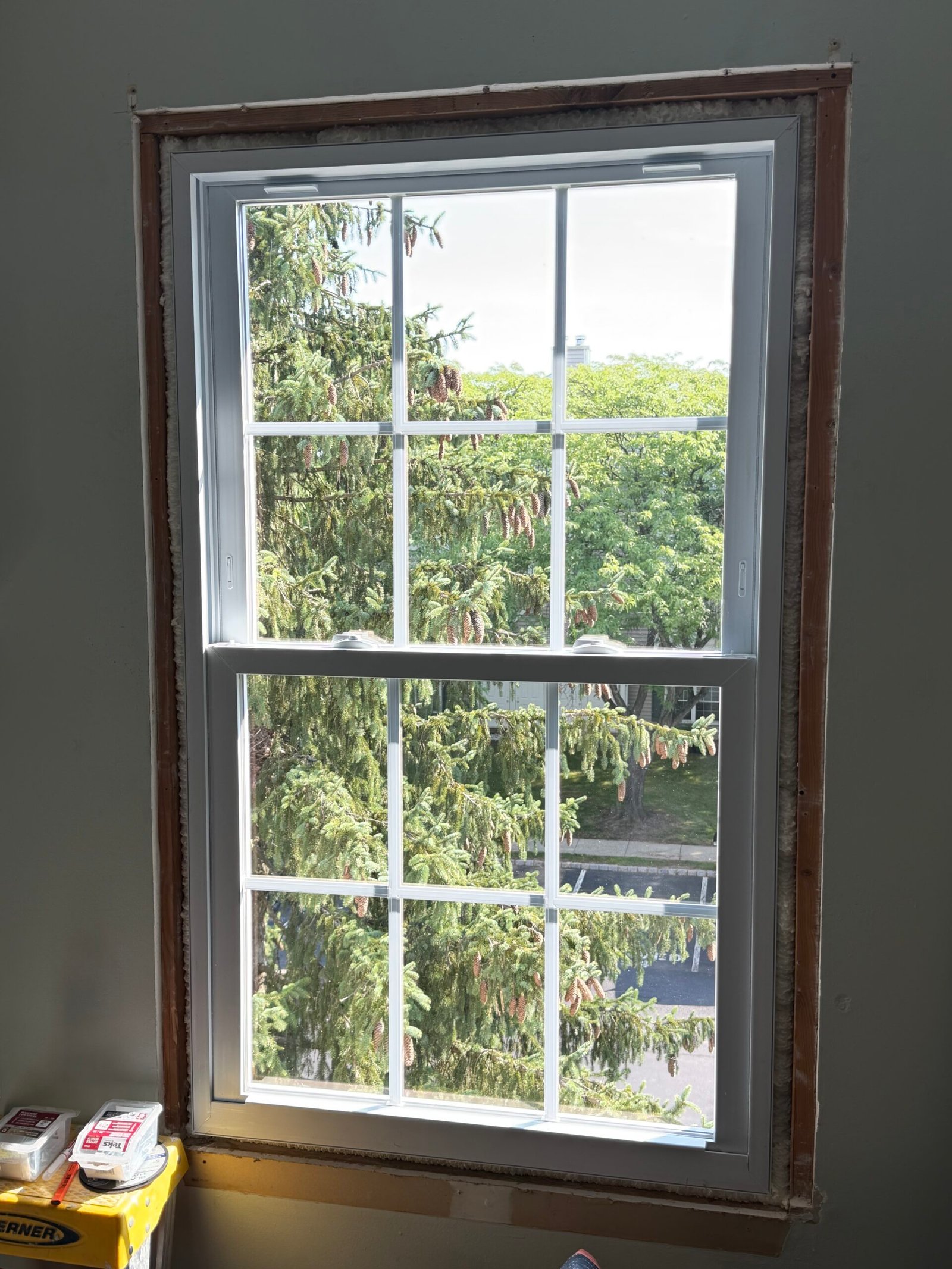 A replacement window installed in the opening before the interior trim was renewed.