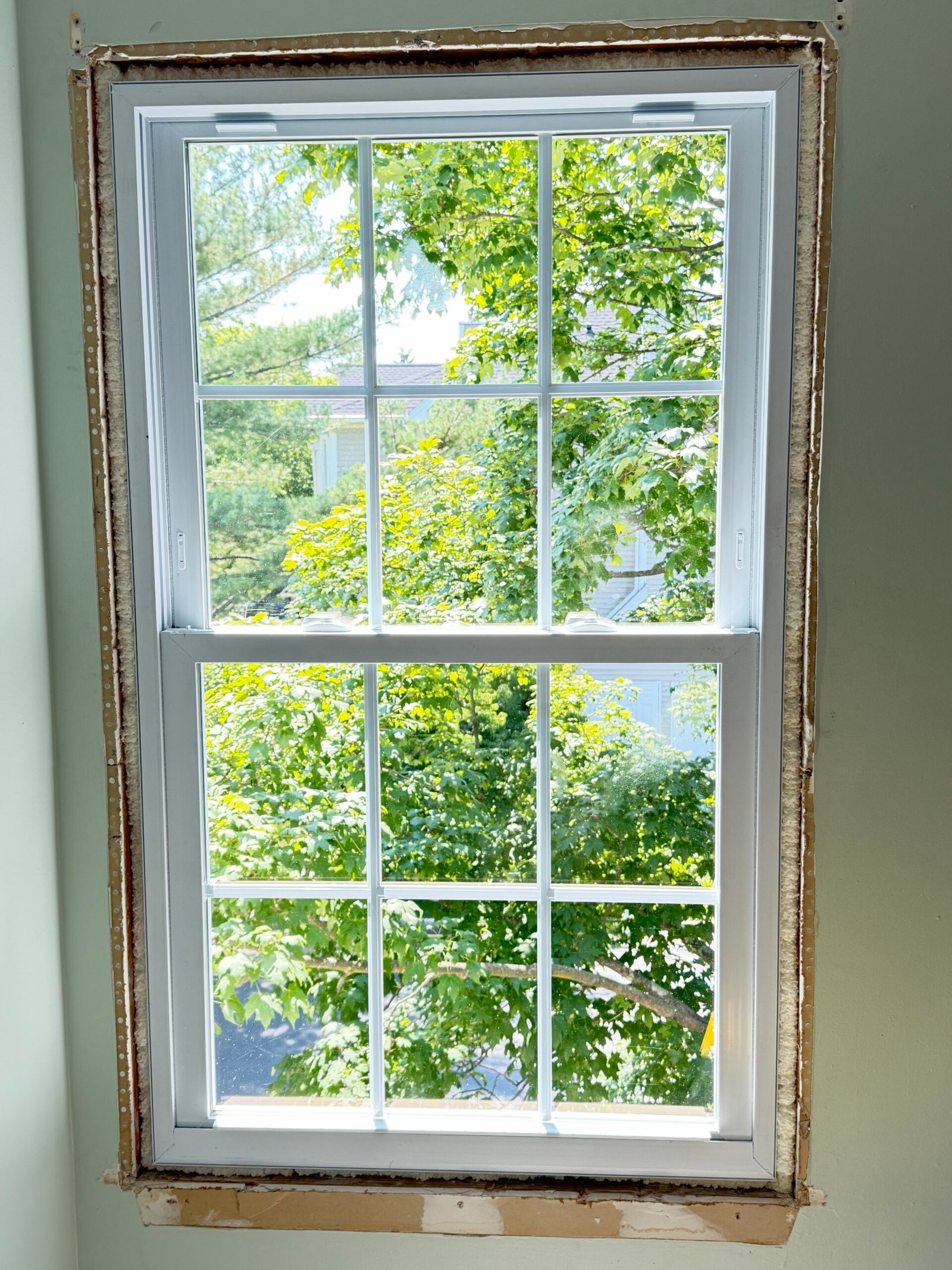 A closer view of the replacement frame and unfinished surrounding opening.
