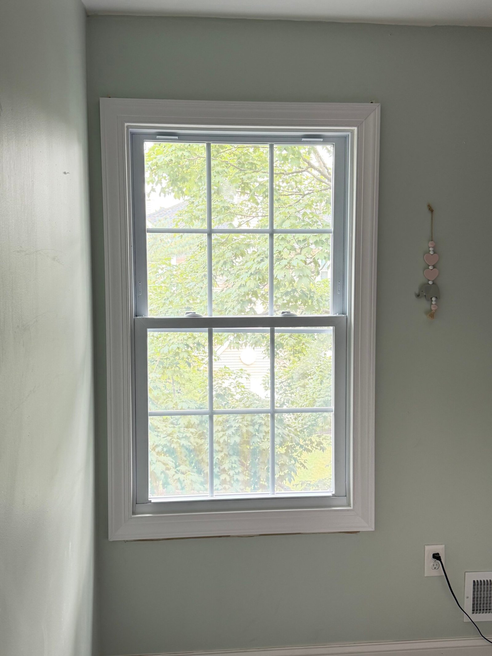 After: the second replacement window and its white interior casing.