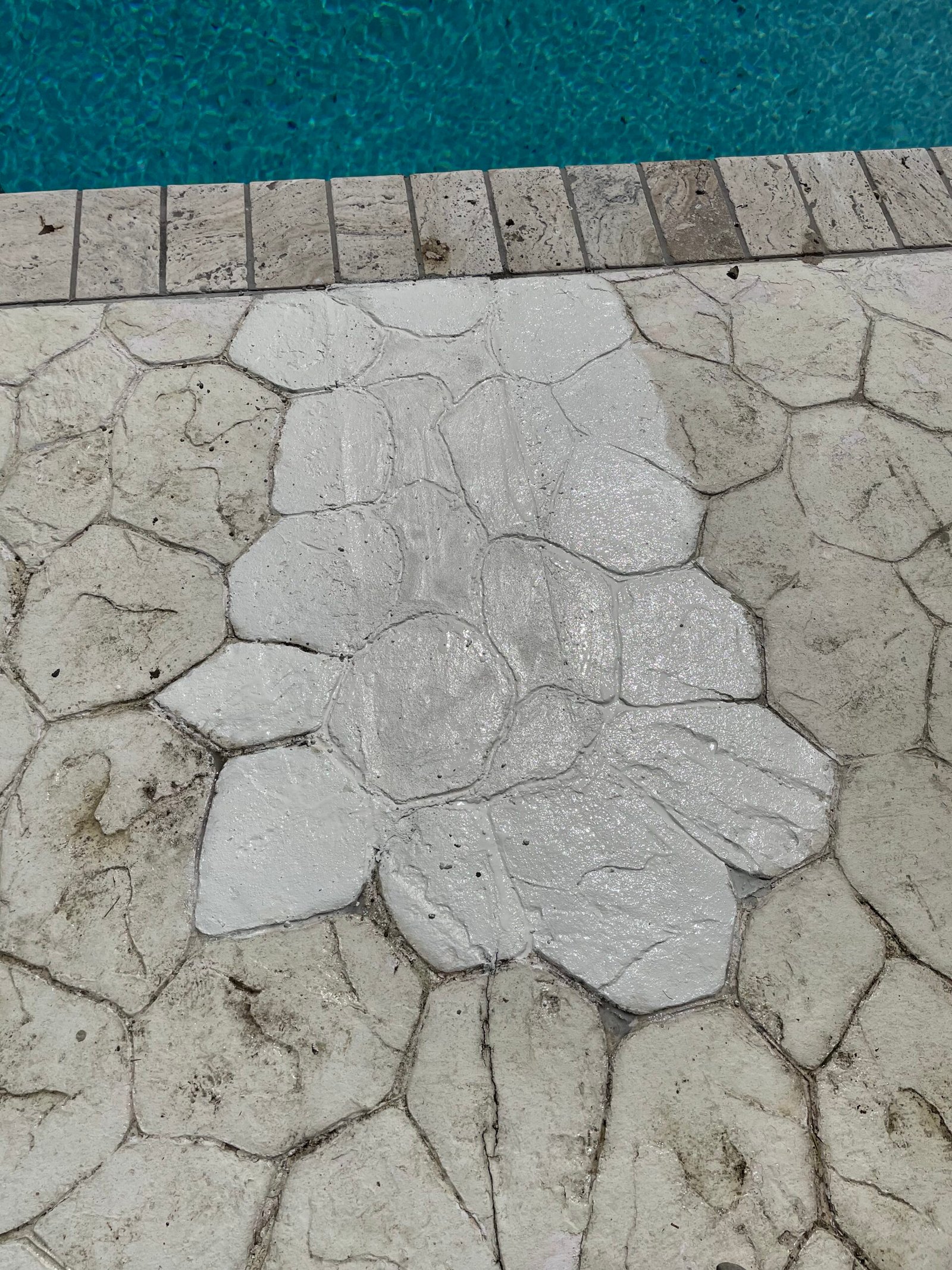 The repaired stone-pattern strip with a light finish and shaped texture.