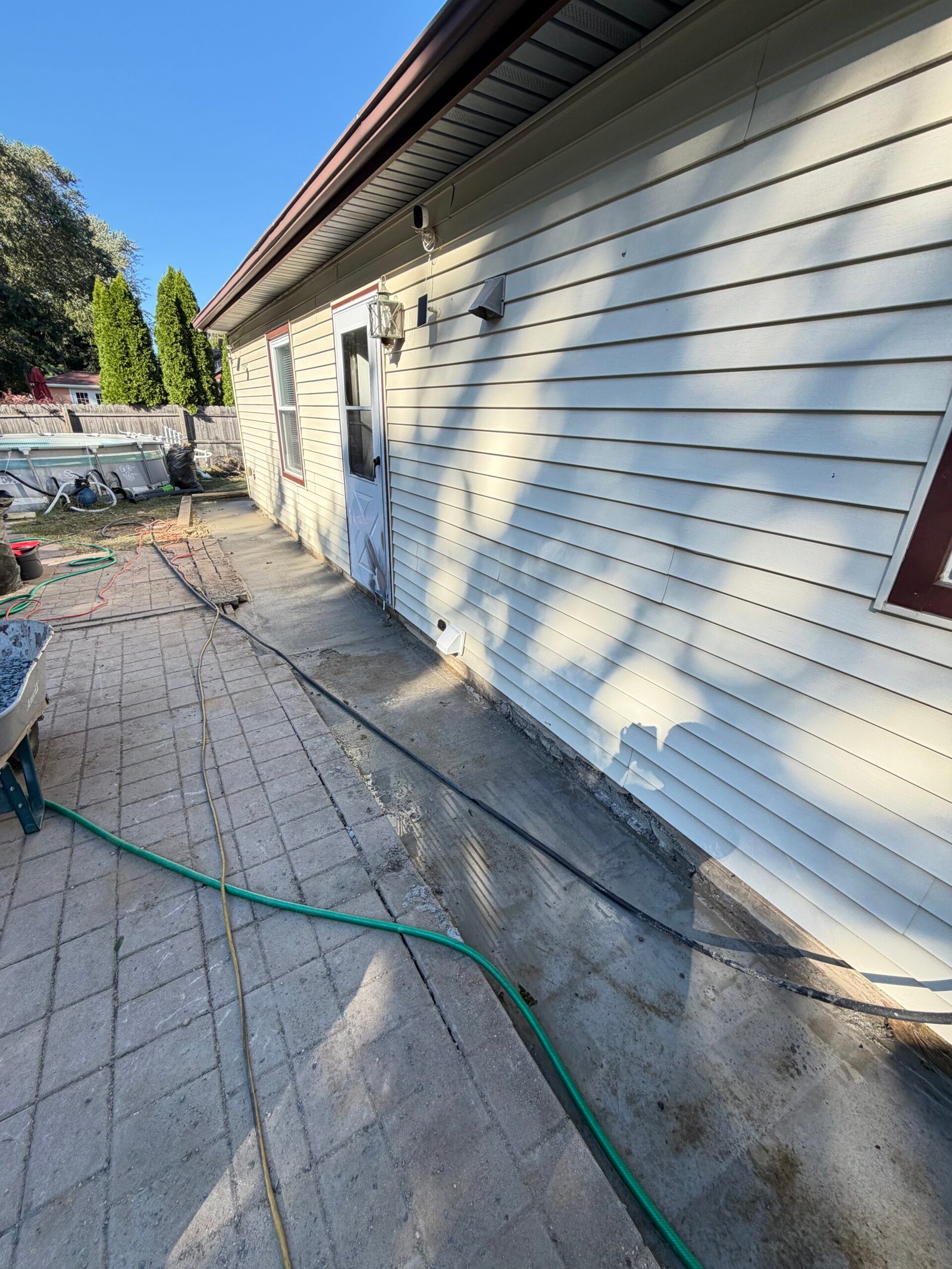 After: the reinforced concrete slab running along the existing house foundation.