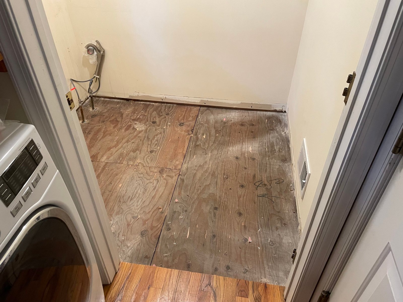 Starting point: the exposed bathroom subfloor before the new floor assembly.