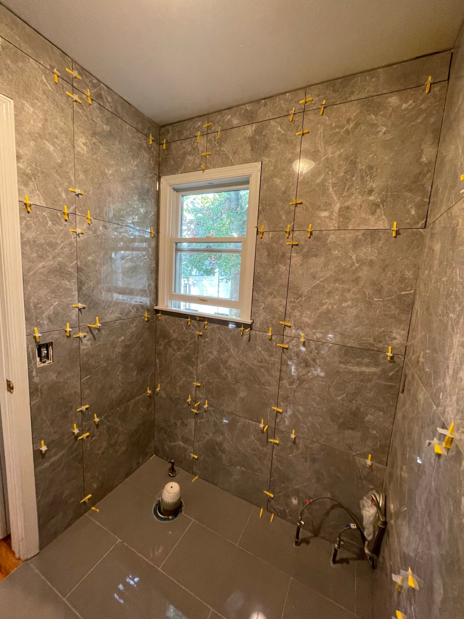 Tile layout around the retained window opening.