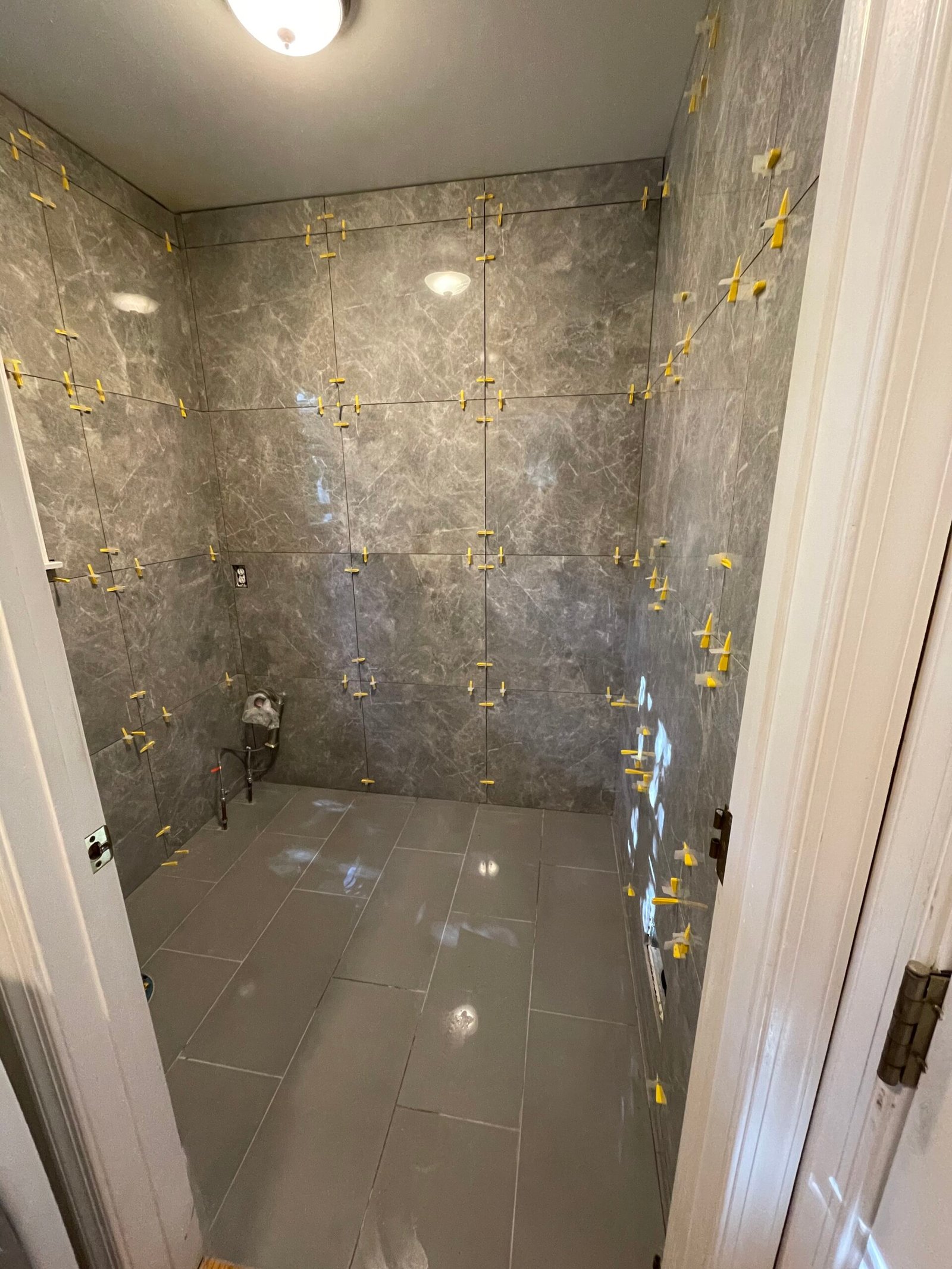 A wider installation view showing the wall joints, floor and doorway transitions.