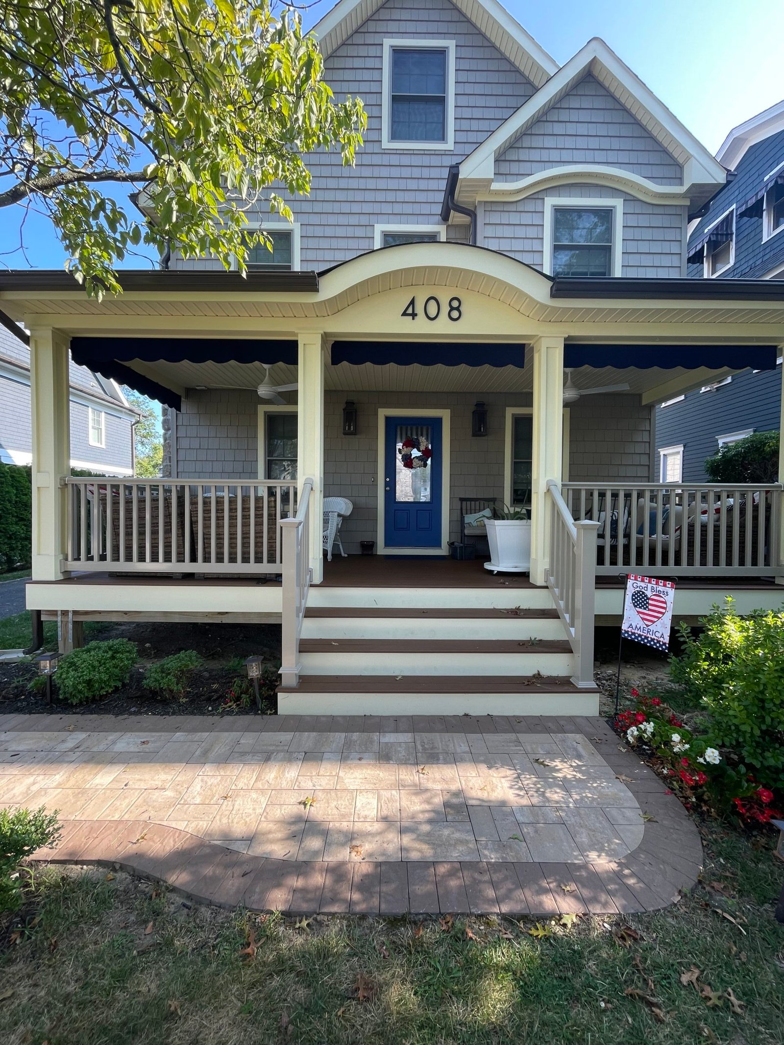 Before: the covered front porch, original entry steps and open areas below the platform.