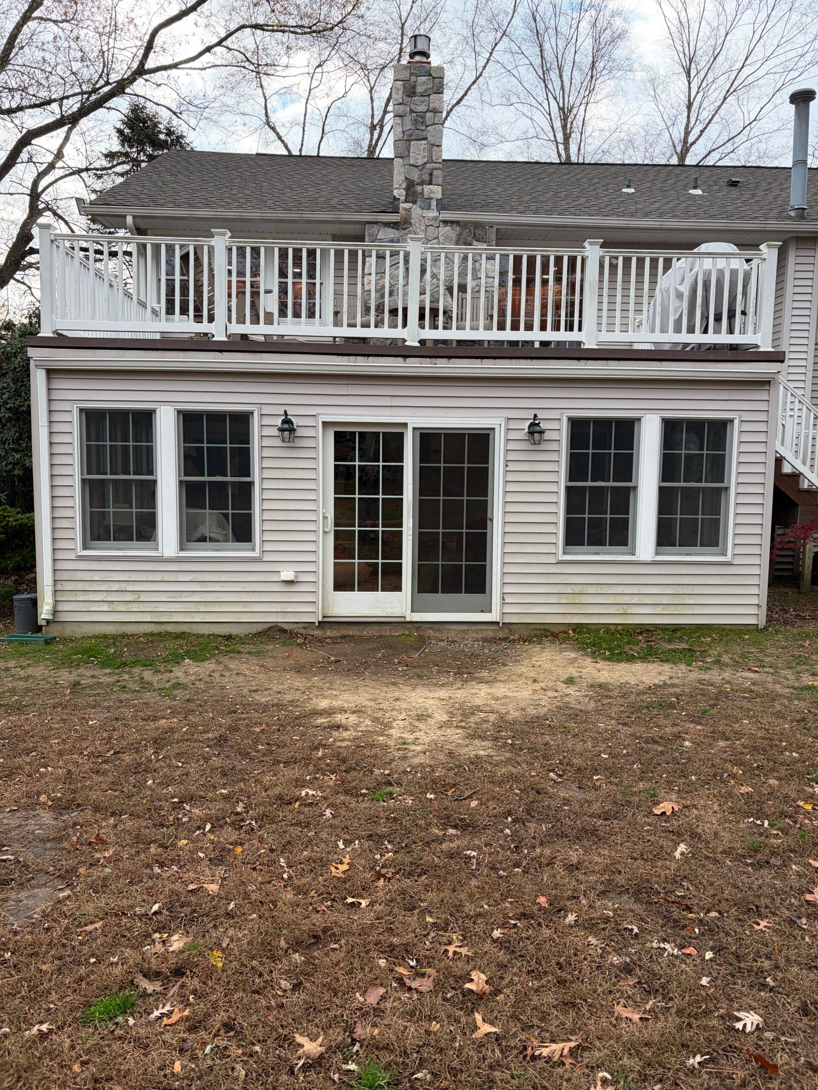 Before: open ground directly outside the rear doors, beneath the upper deck.