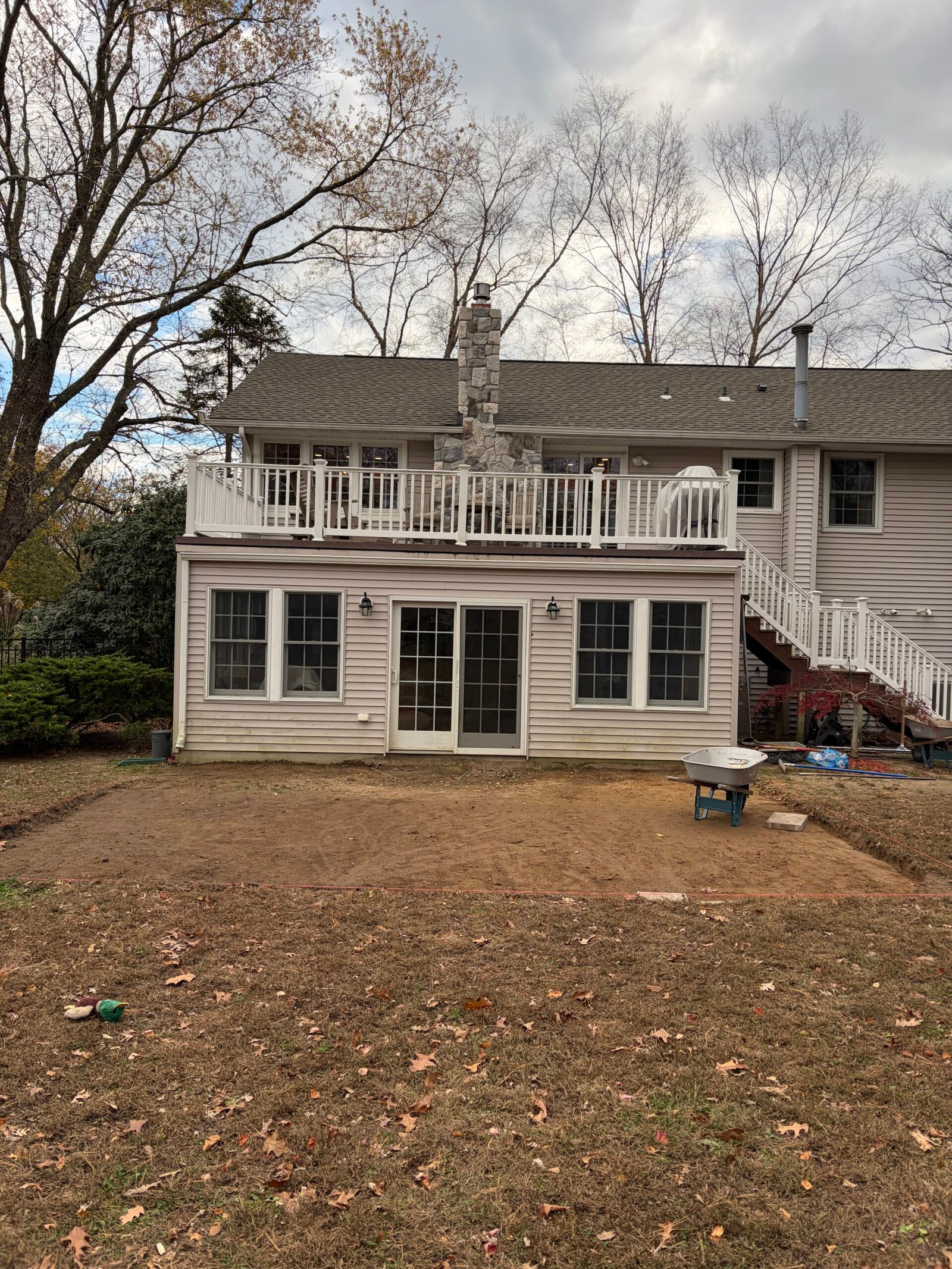 The patio footprint opened and shaped in front of the rear doors.