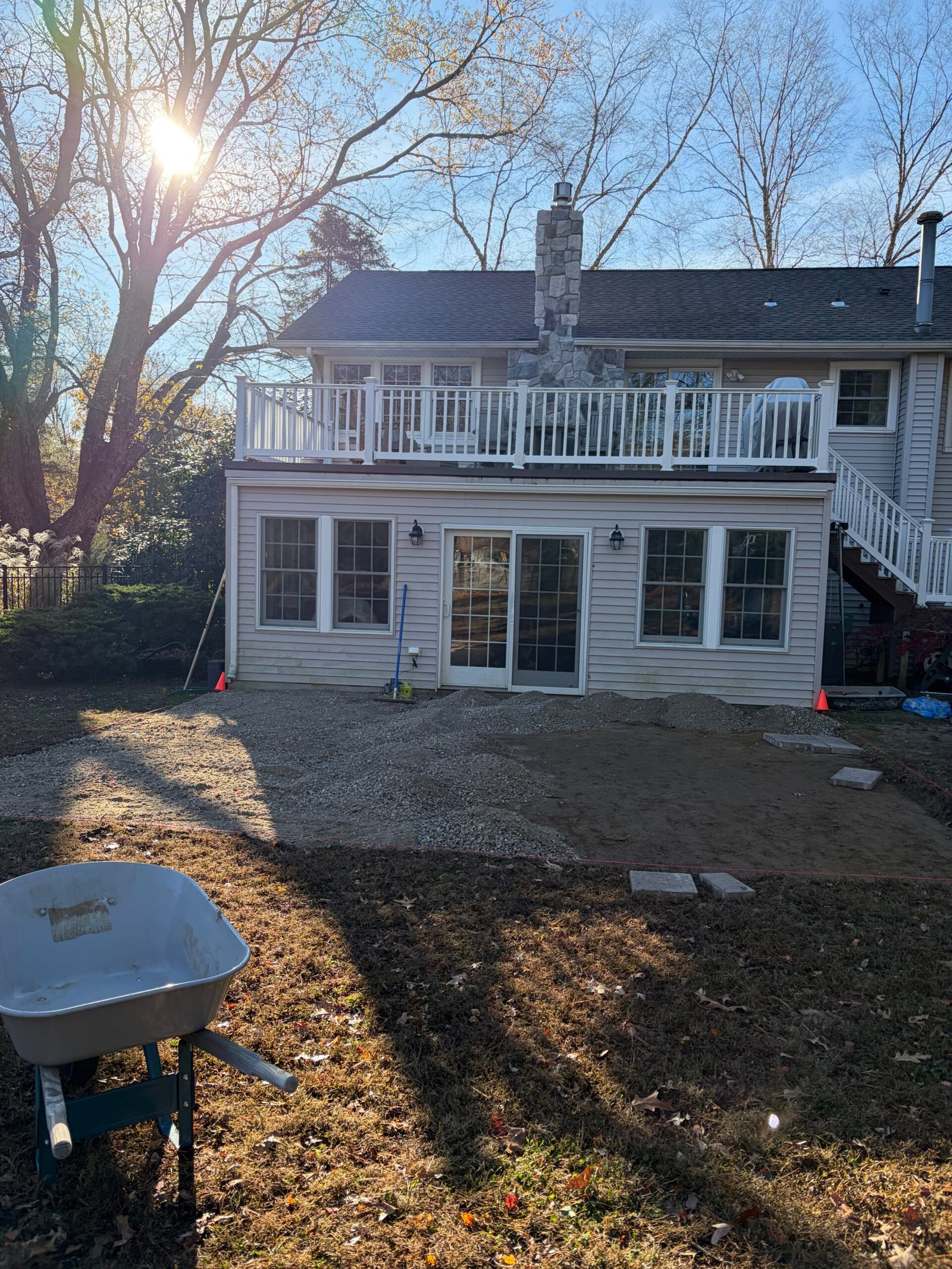 Granular base material spread across the marked patio footprint.