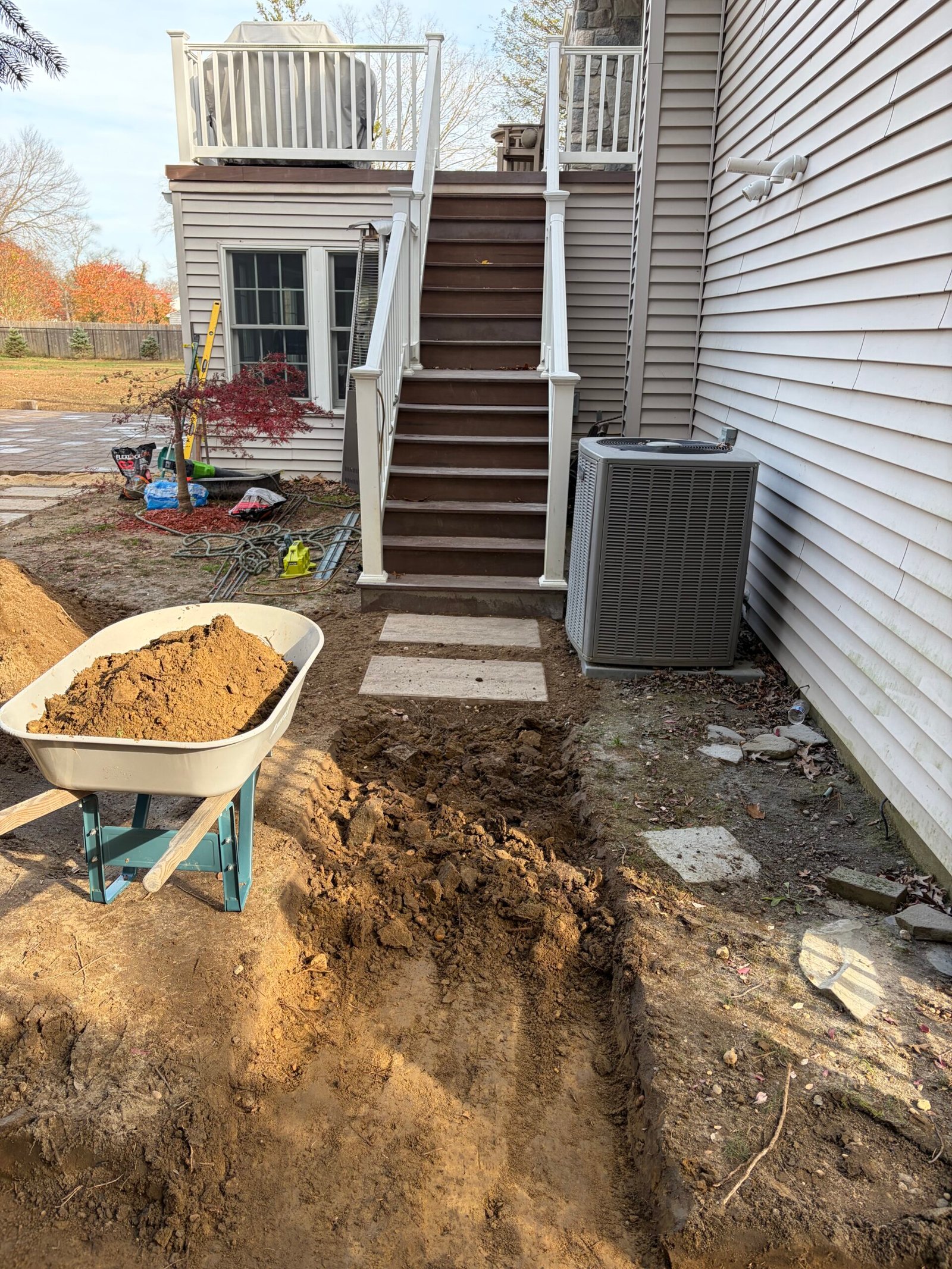 The connection beside the stairs and outdoor equipment during preparation.