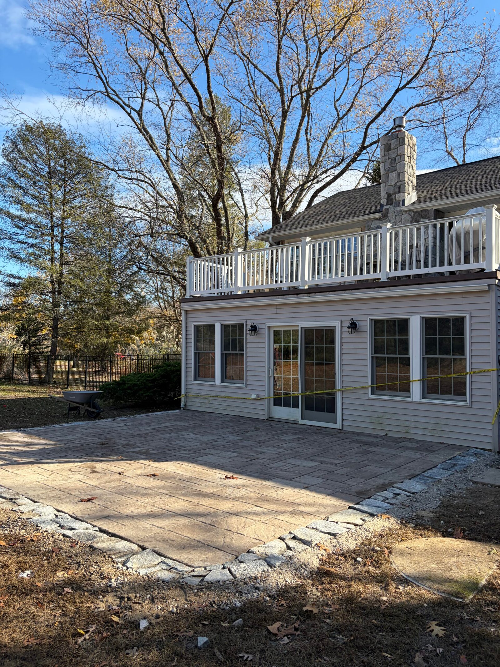 The paver surface and stone border viewed from the rear corner.
