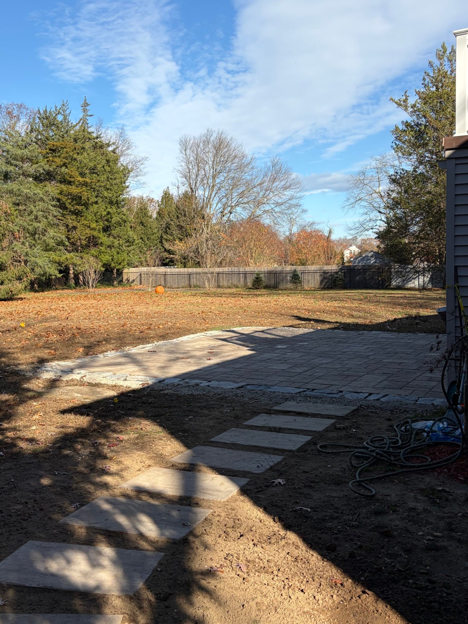 After: the stepping-stone route connecting the side yard with the new rear patio.