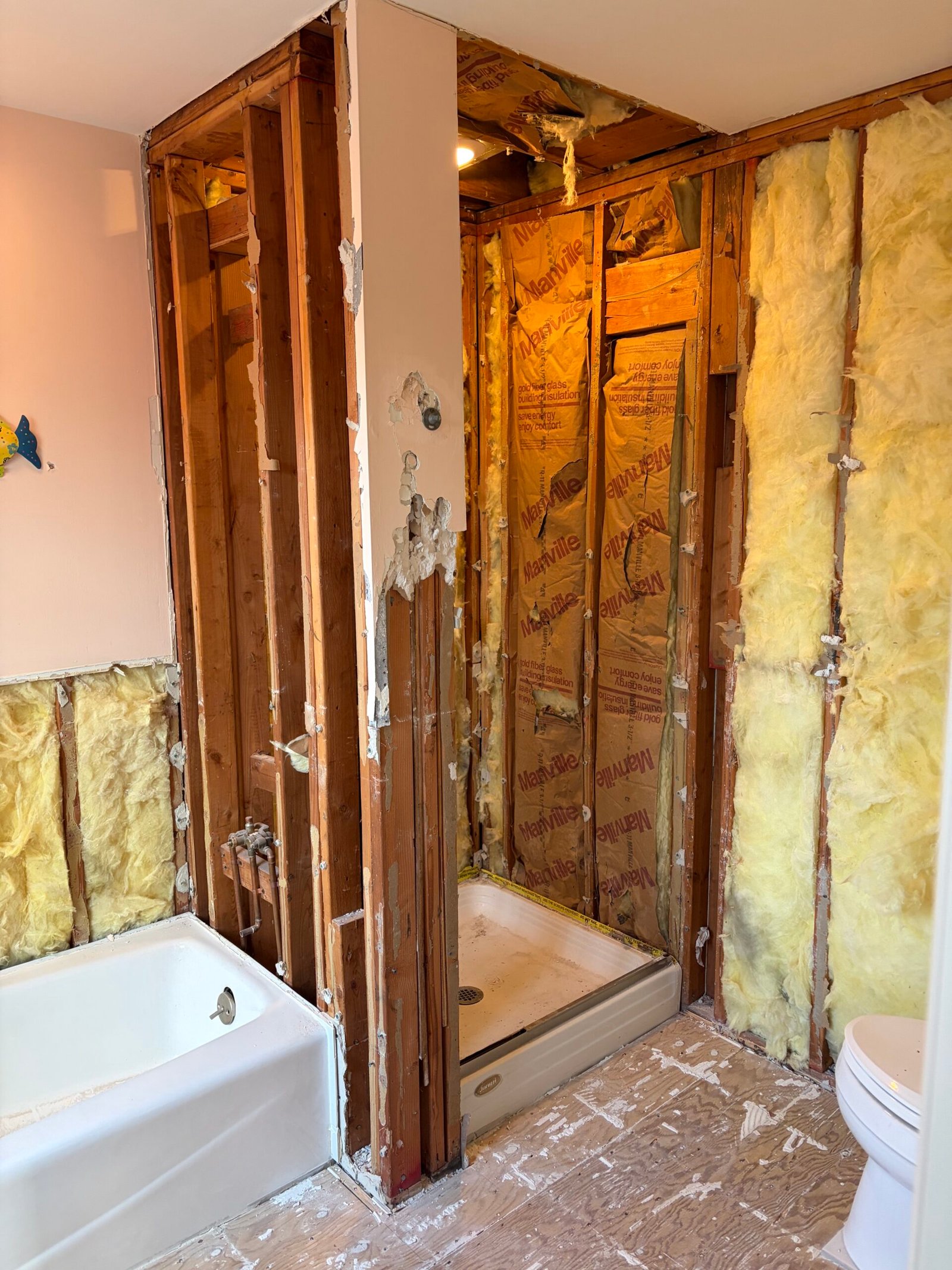 The original enclosed shower opened up during demolition.