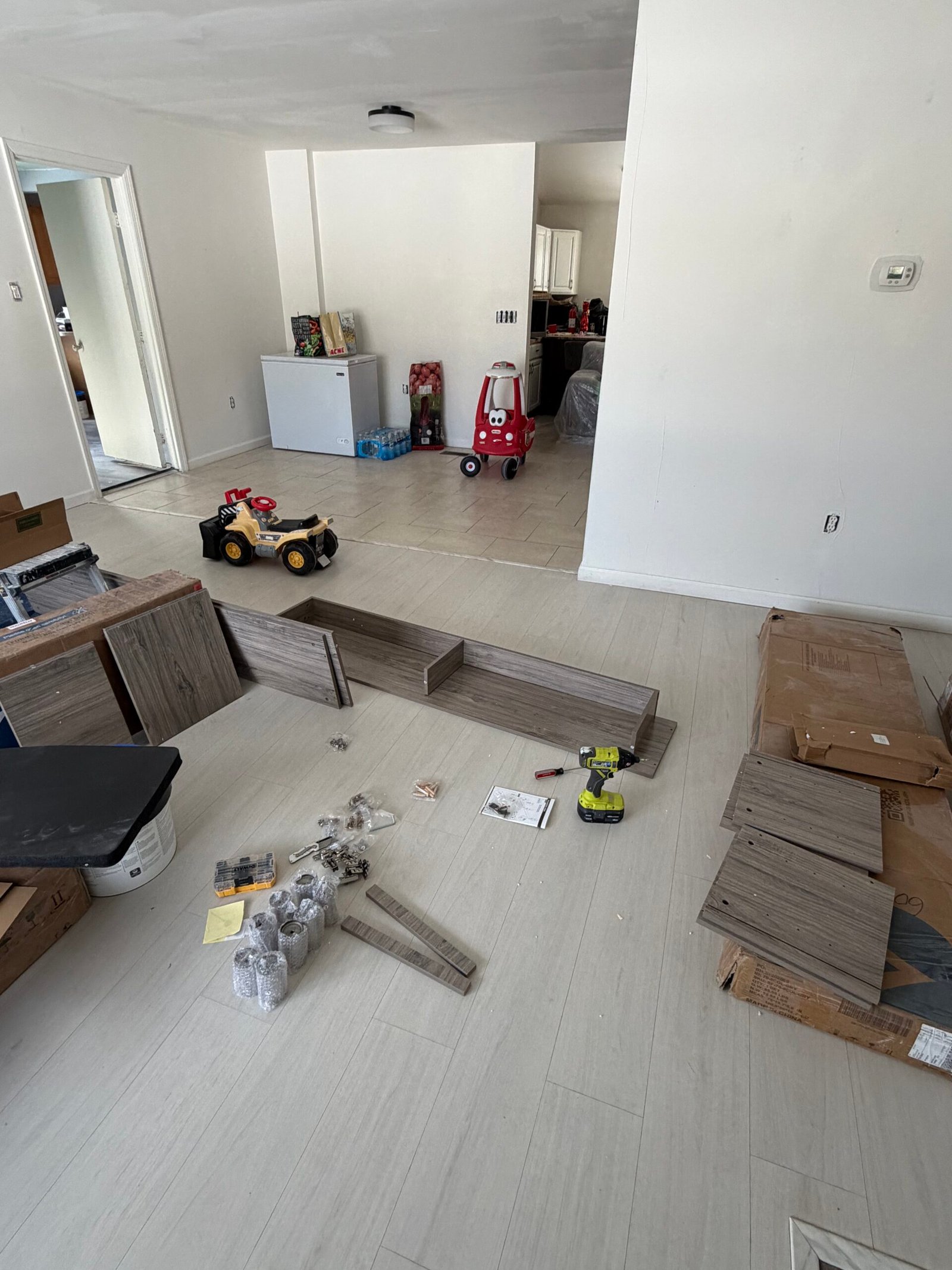 Before: The fireplace TV stand panels and fittings laid out before the console was assembled.