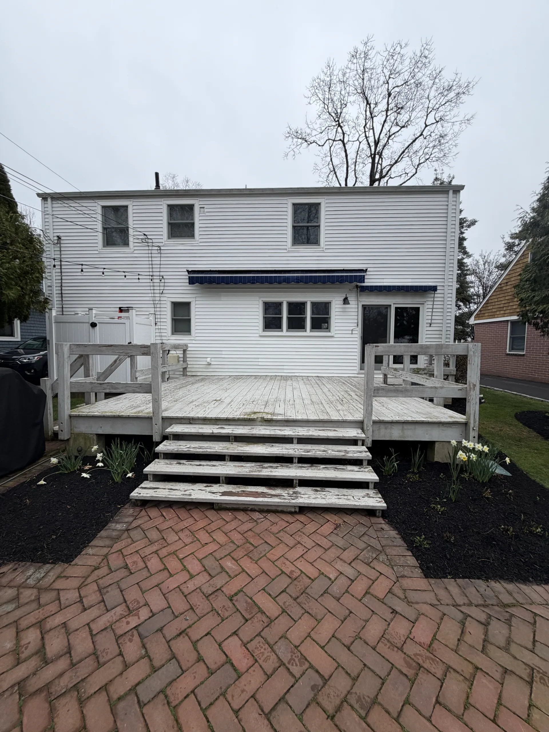 Original deck and main steps from the brick patio