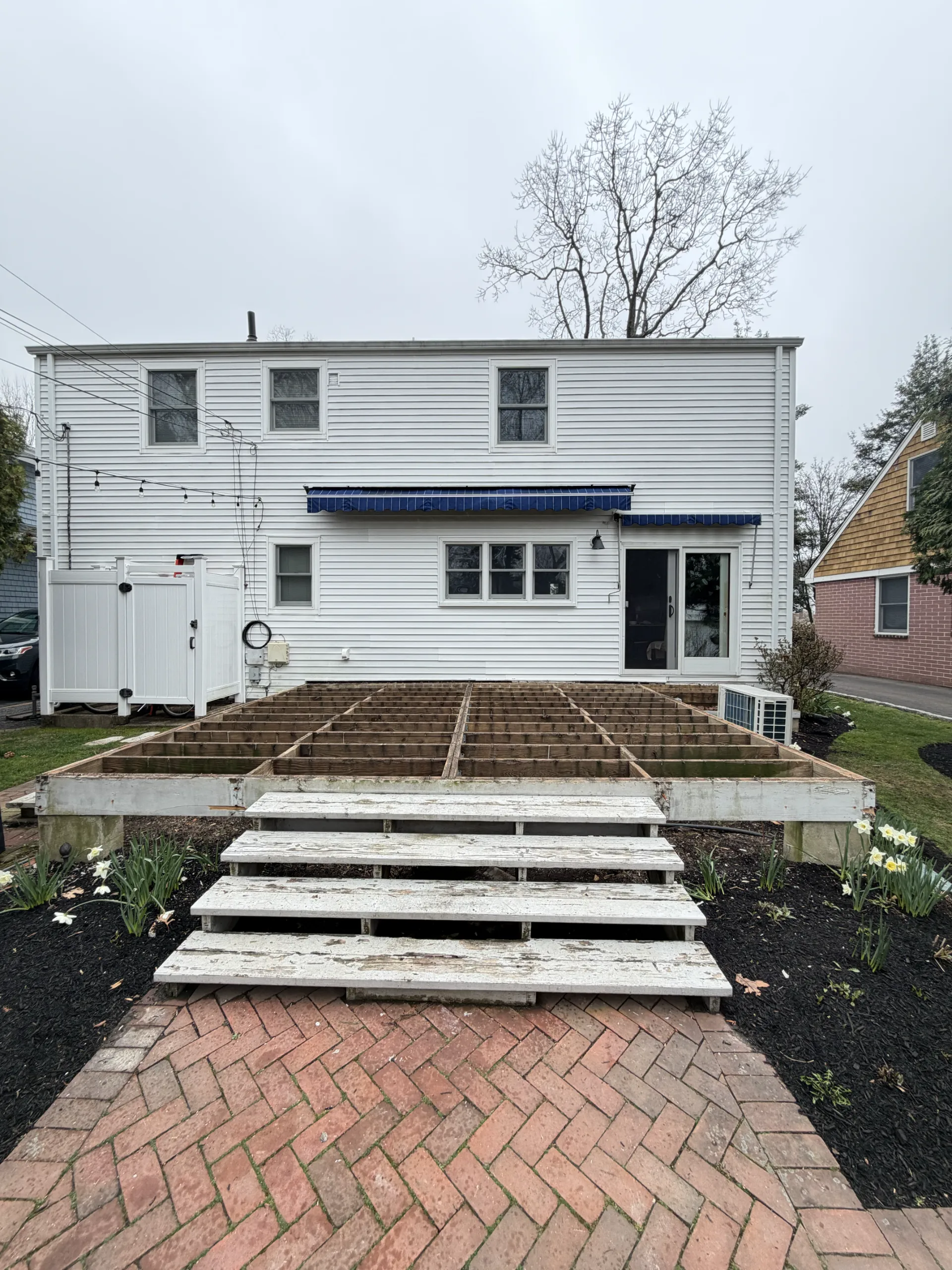 Deck boards and guardrails removed, with the frame exposed