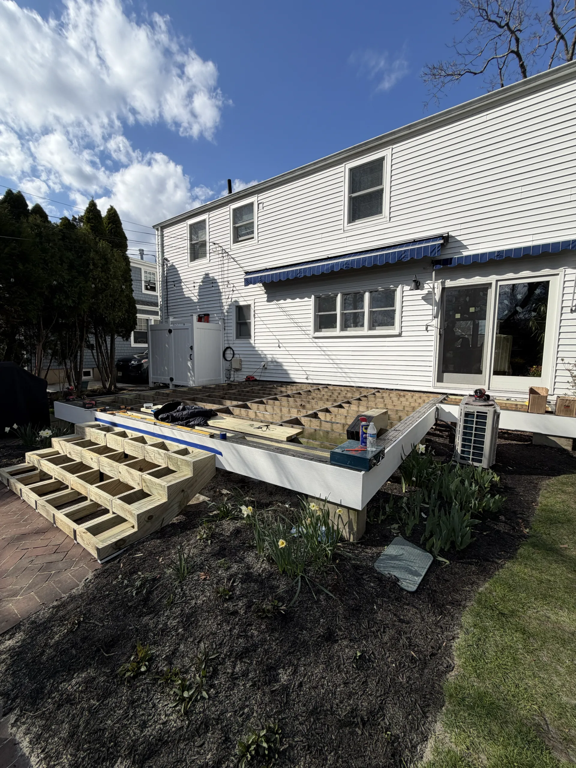 New main stair framing and white perimeter fascia in progress