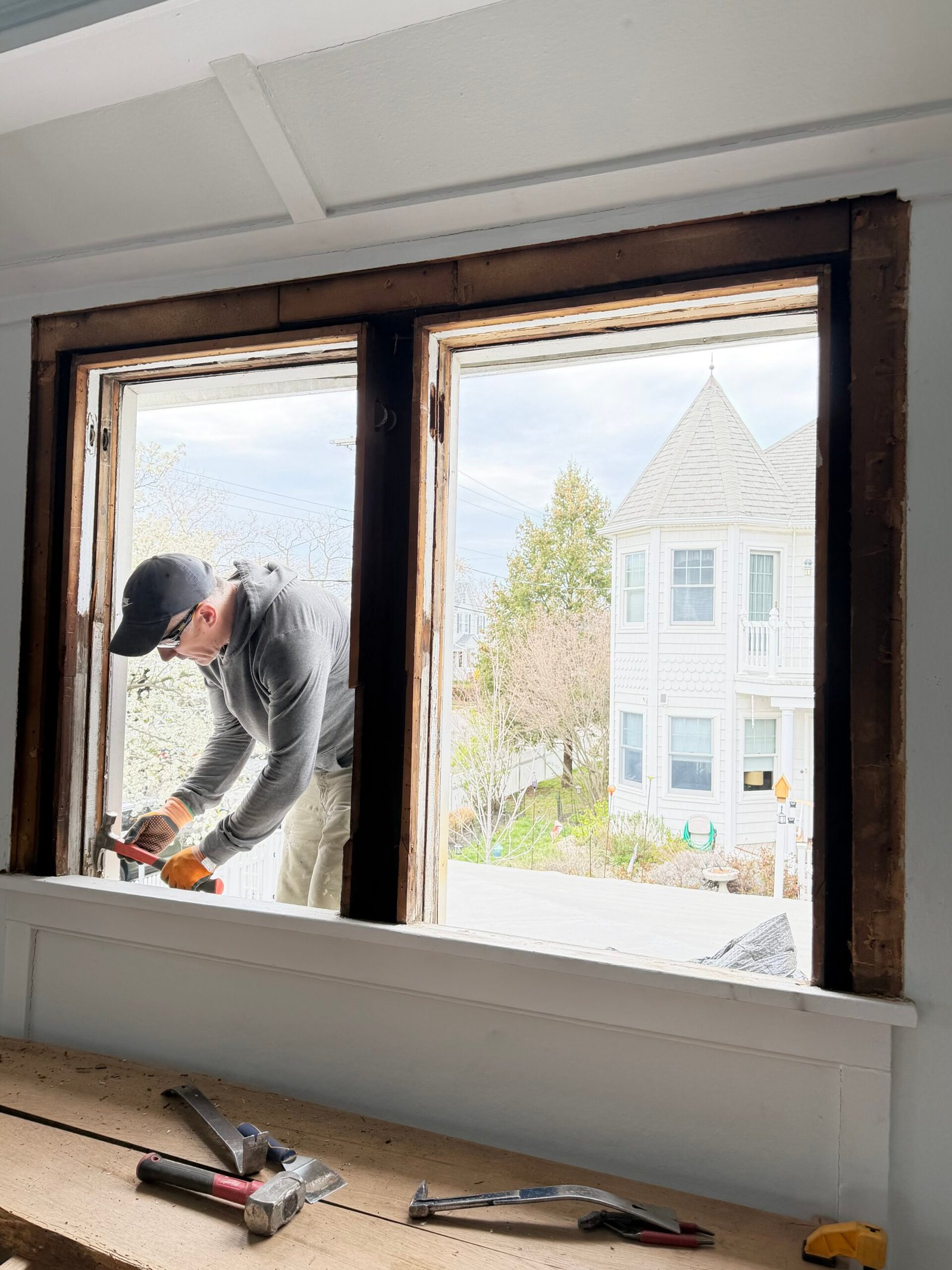 A closer view of work around the paired openings before the new windows were completed.