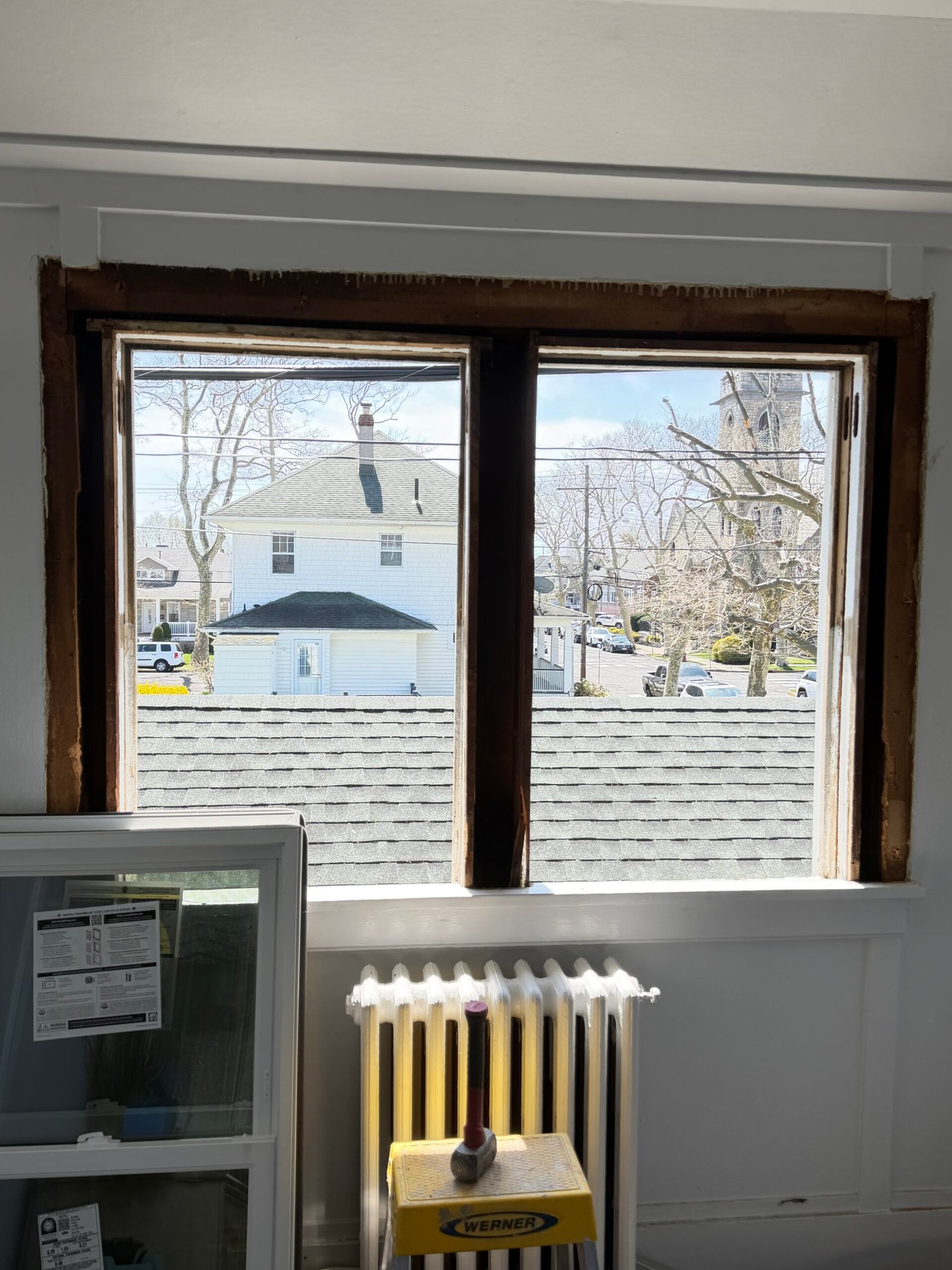 The timber perimeters of another pair of openings exposed before replacement installation.