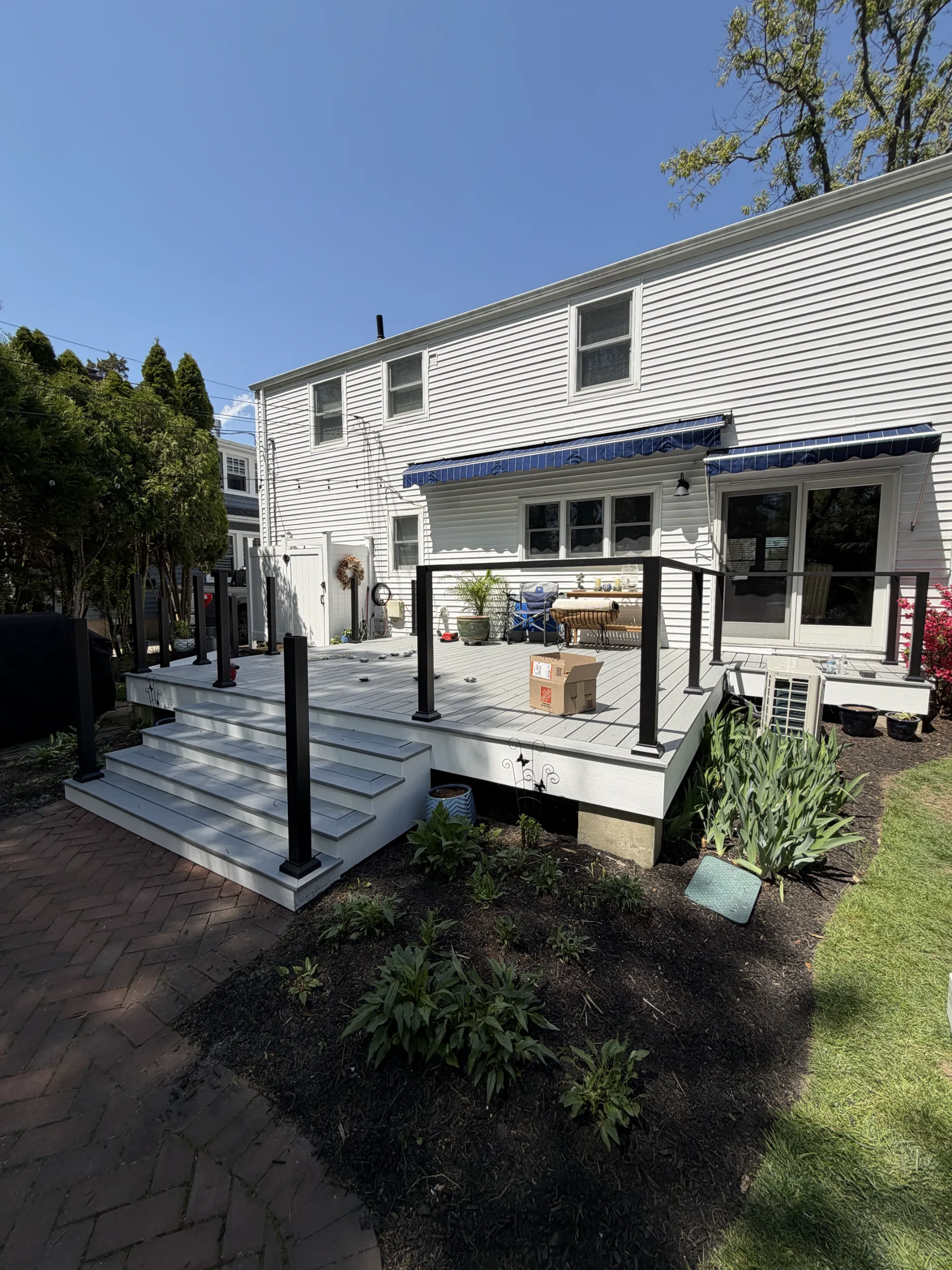 Black perimeter posts installed around the renewed deck