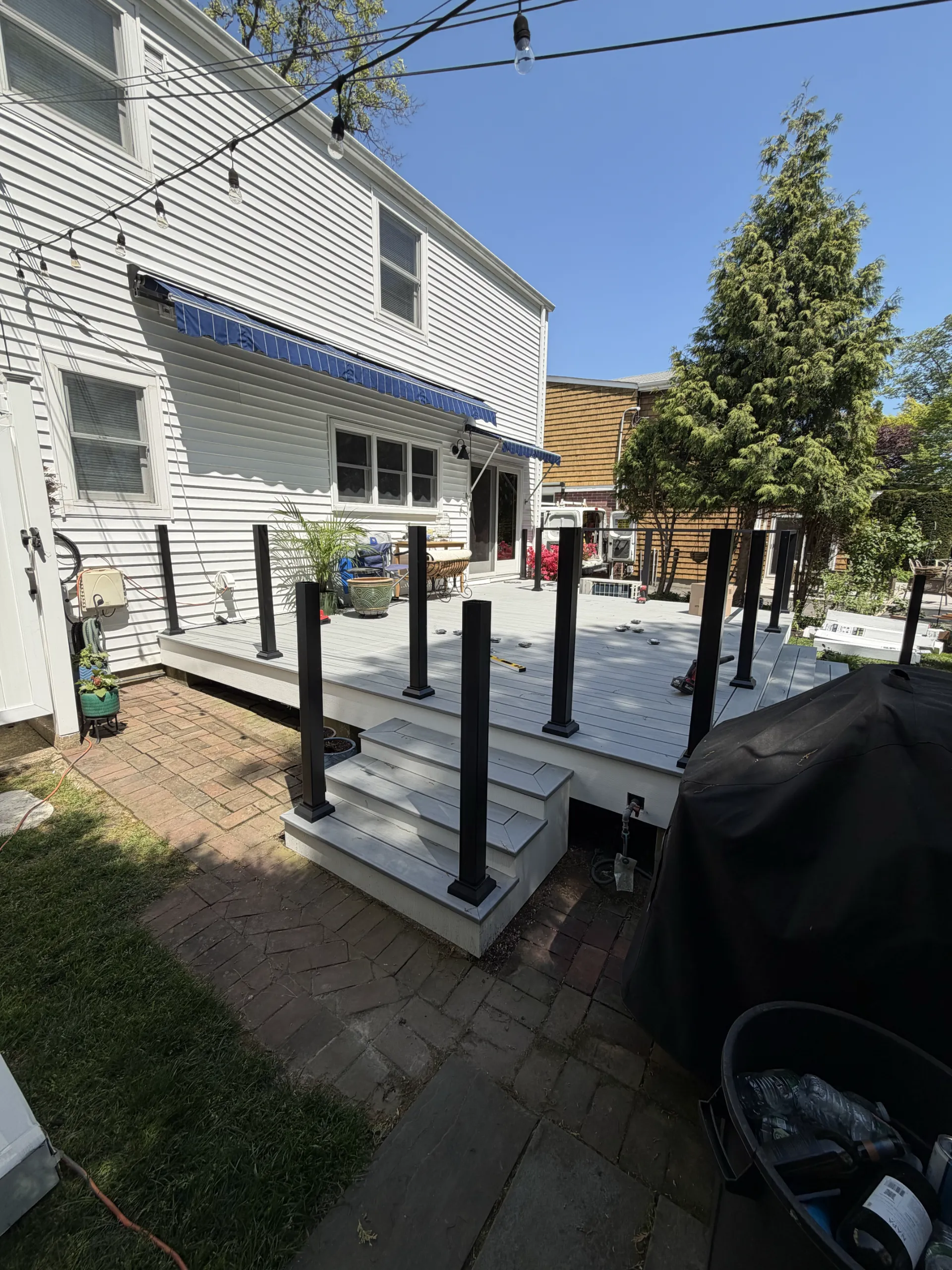Railing posts positioned beside the side steps