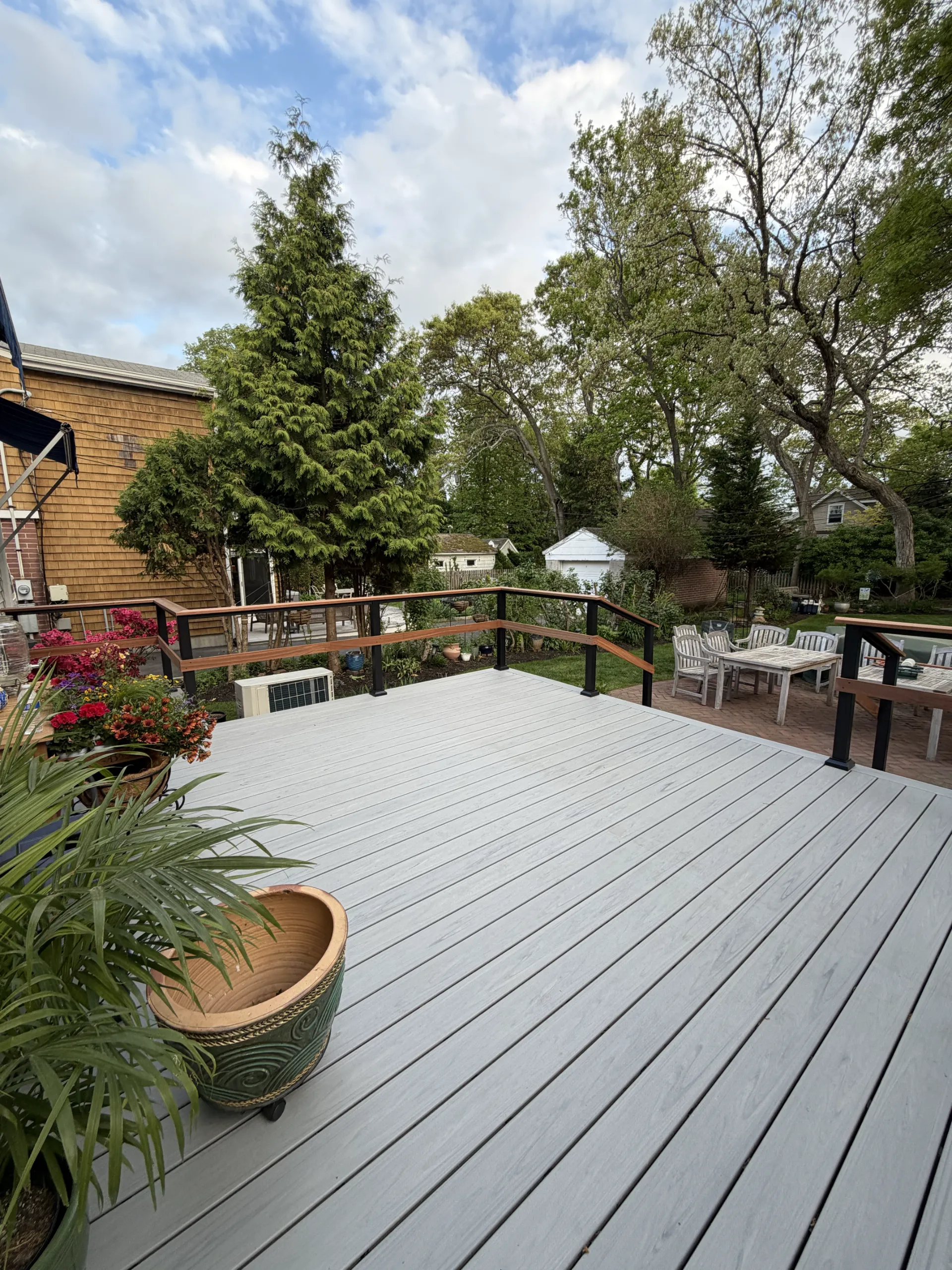 The renewed deck surface and finished perimeter railings