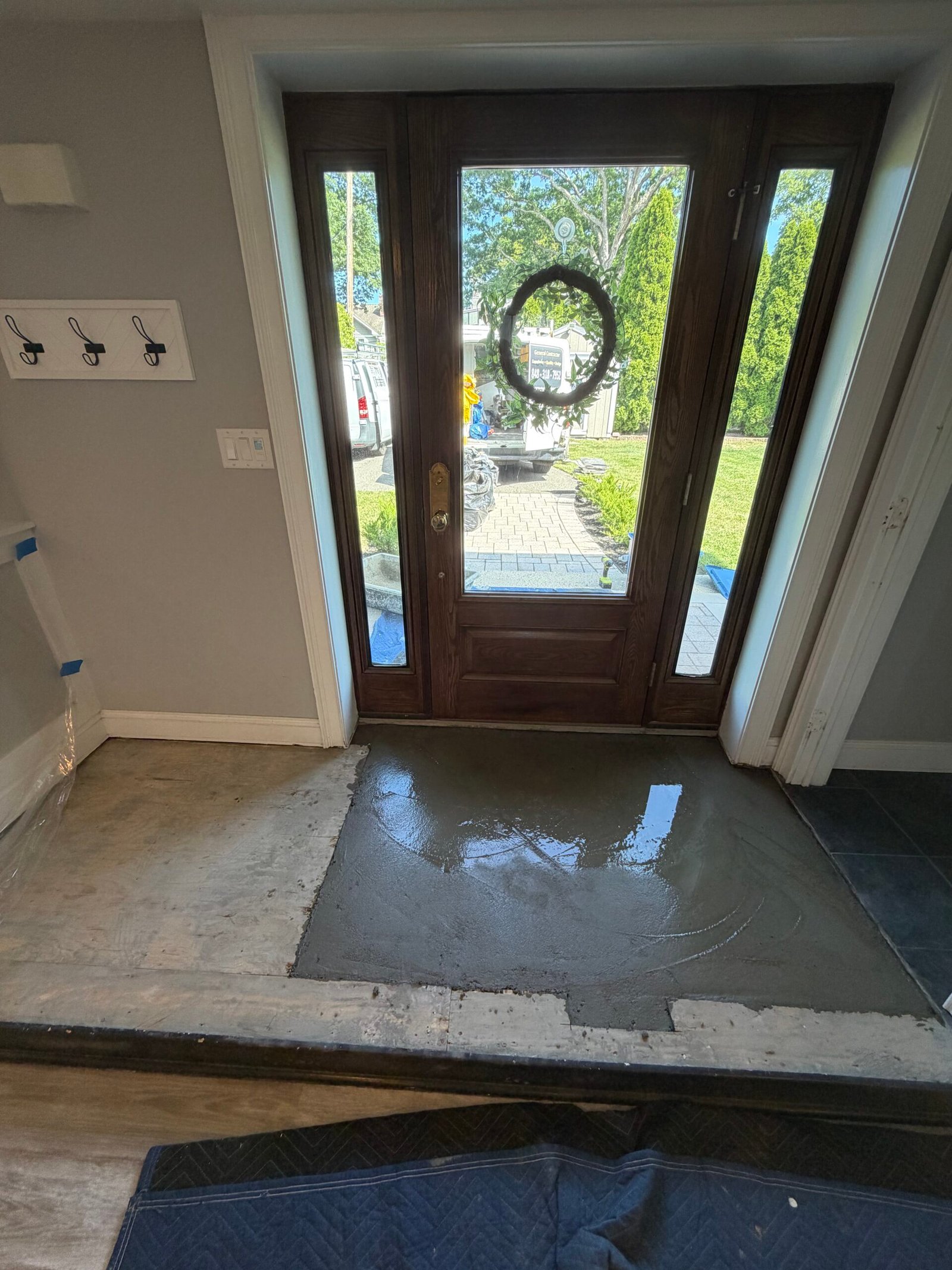 The newly filled entry base before the tile underlayment was installed.