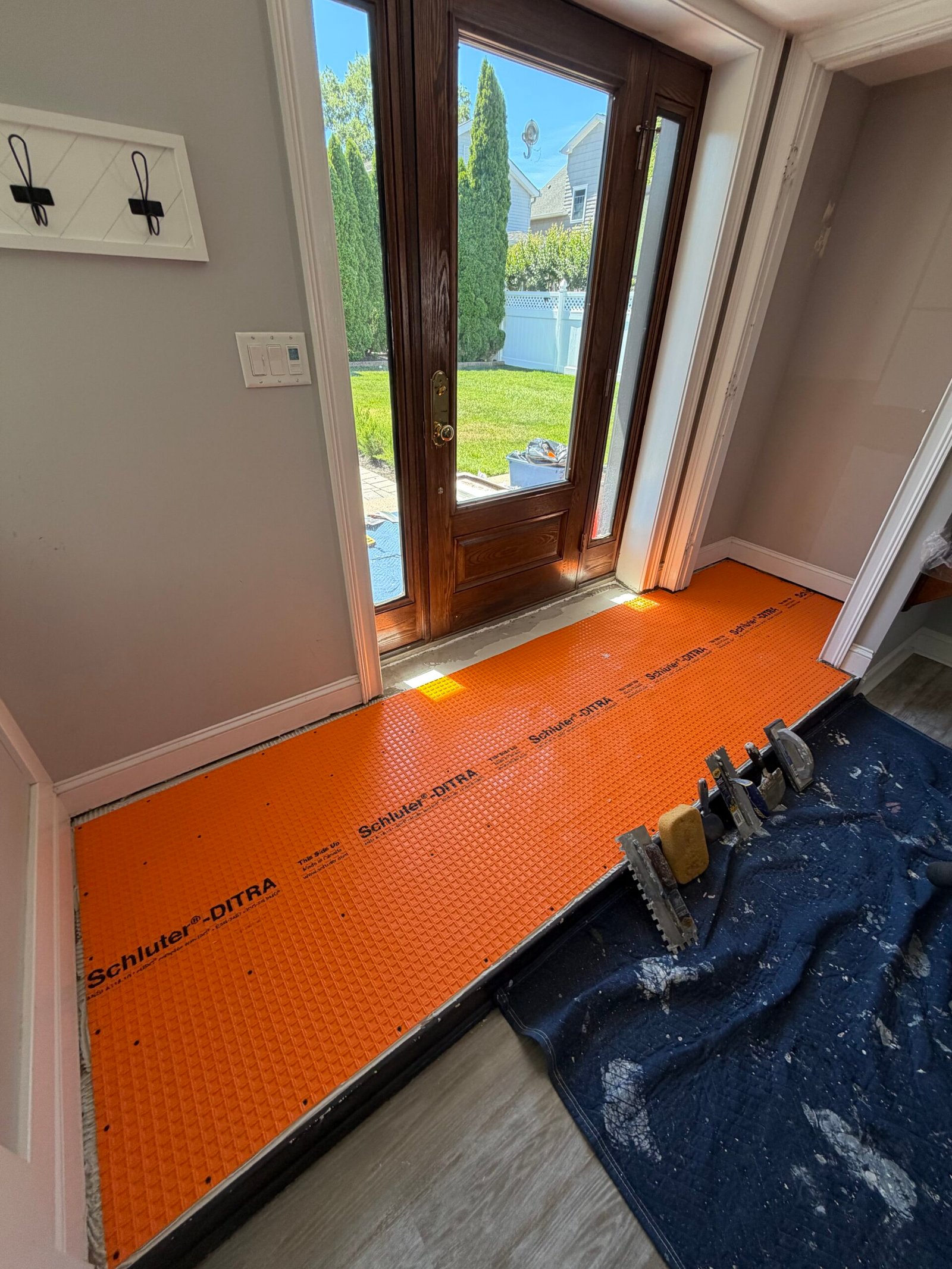 The underlayment and perimeter details before the new floor tiles were laid.