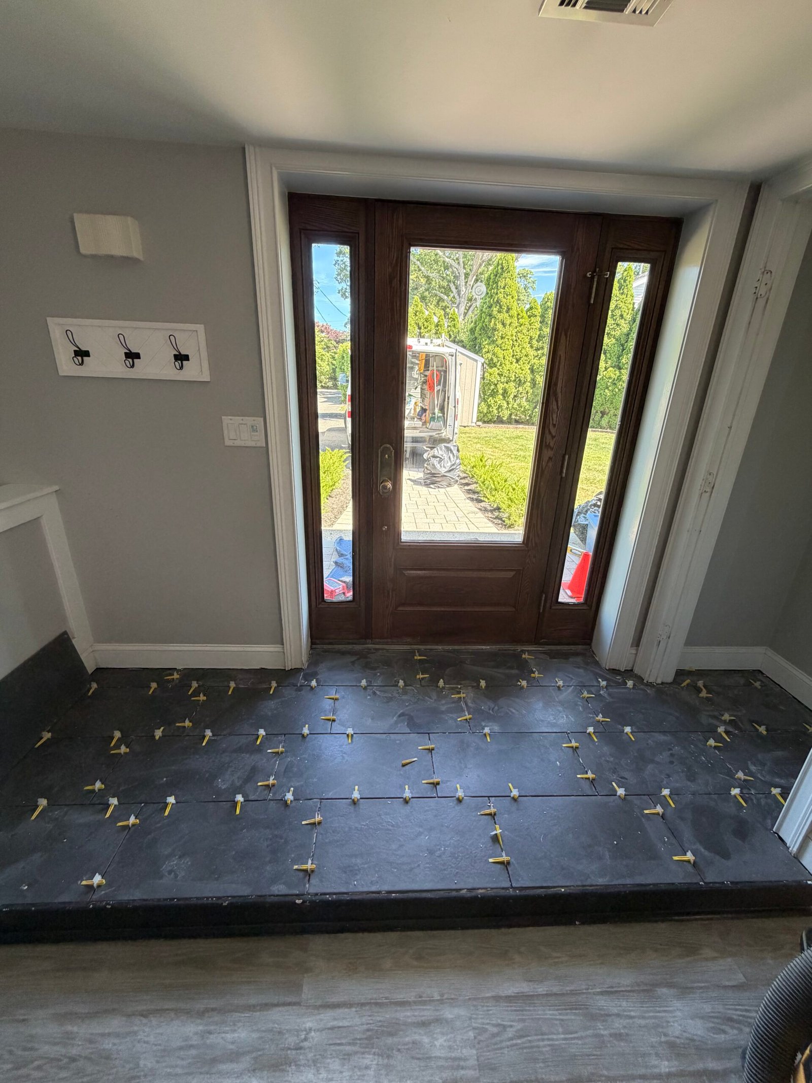The main entry tile layout in place before the final joint finishing and cleanup.