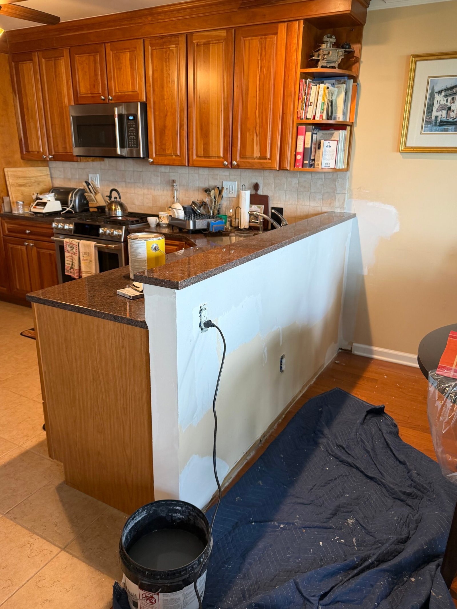 The refitted counter cap and wall coating still in progress.