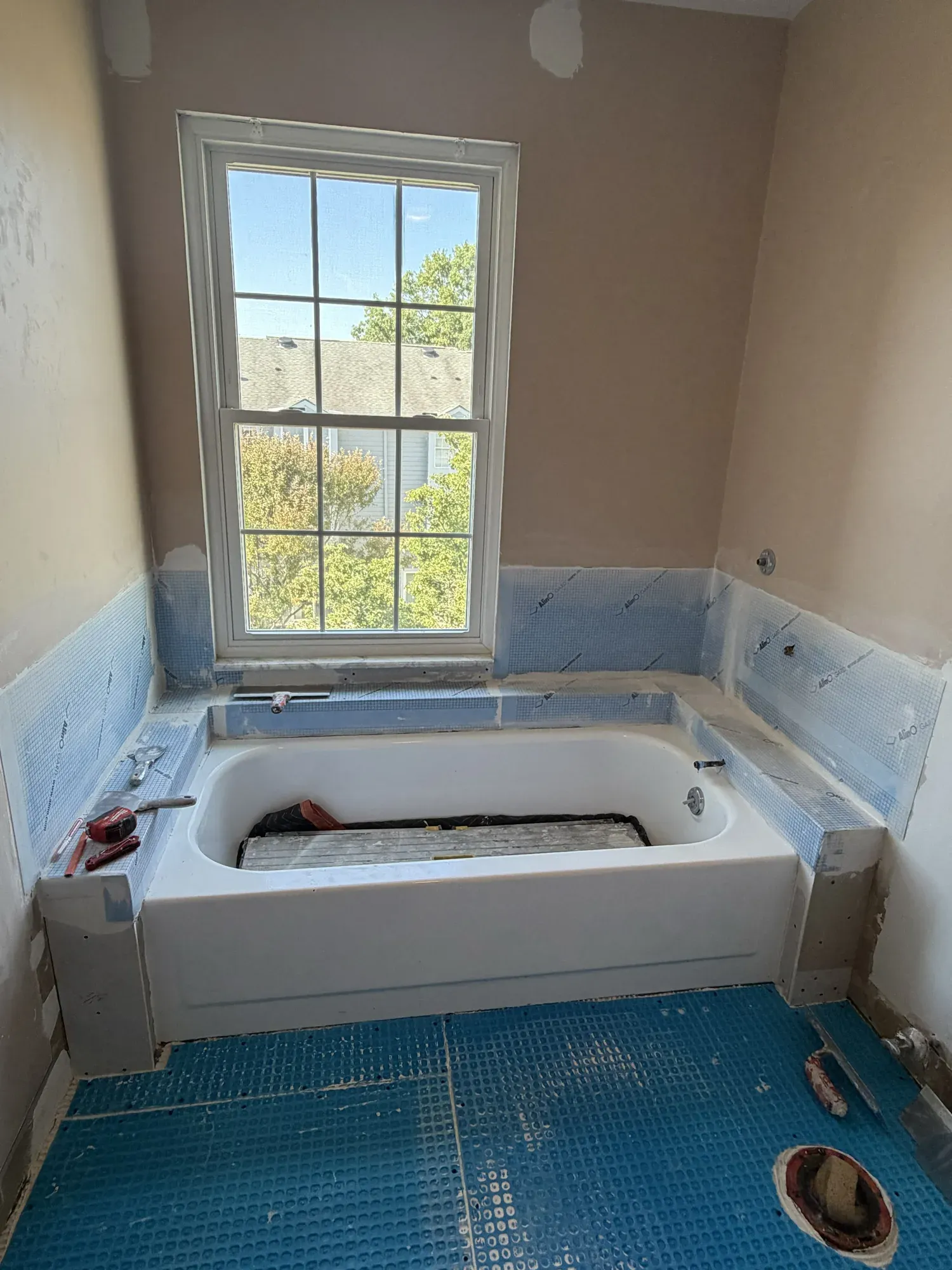 Tub surround and floor underlayment preparation