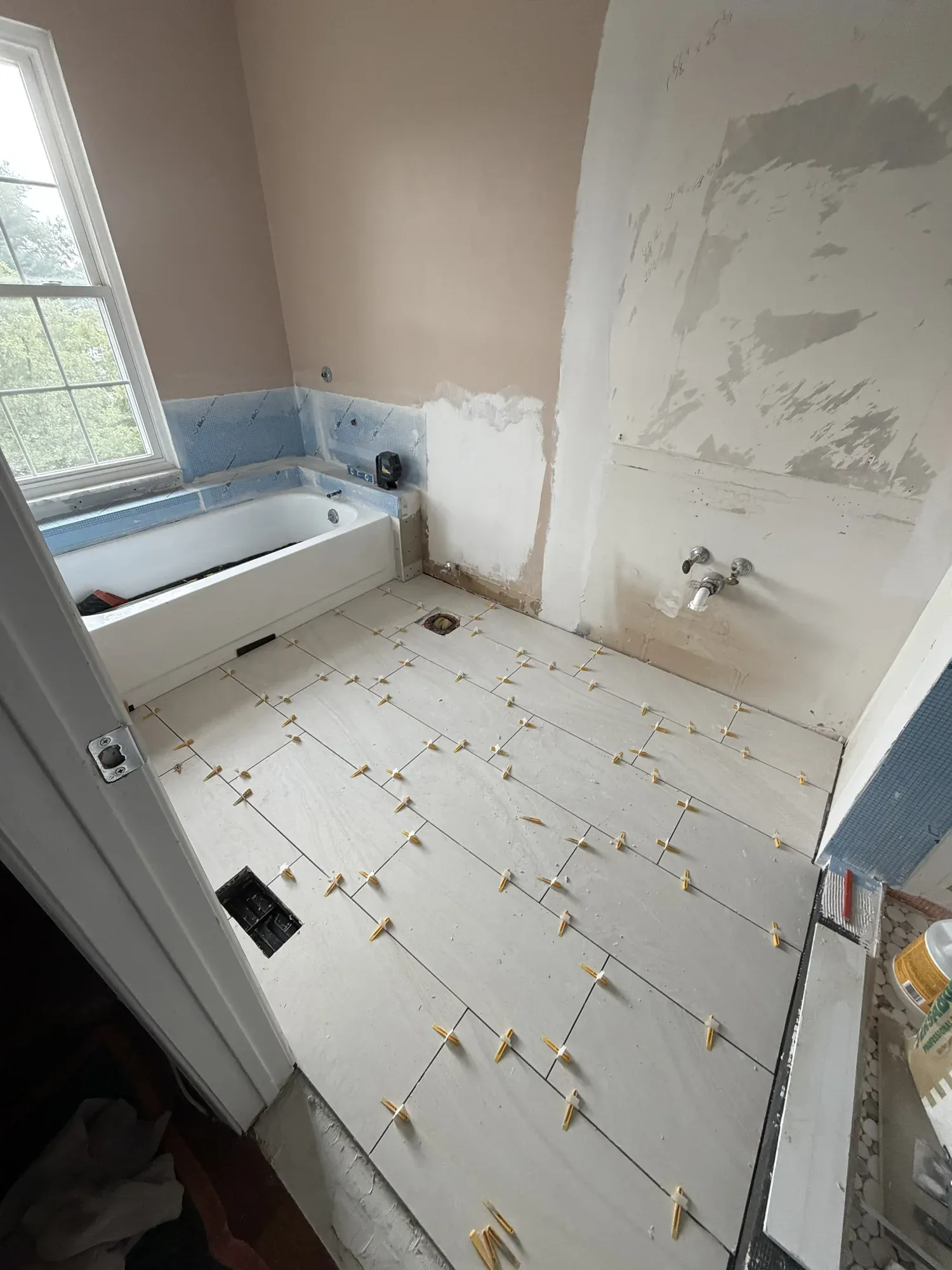 New bathroom floor tile during installation