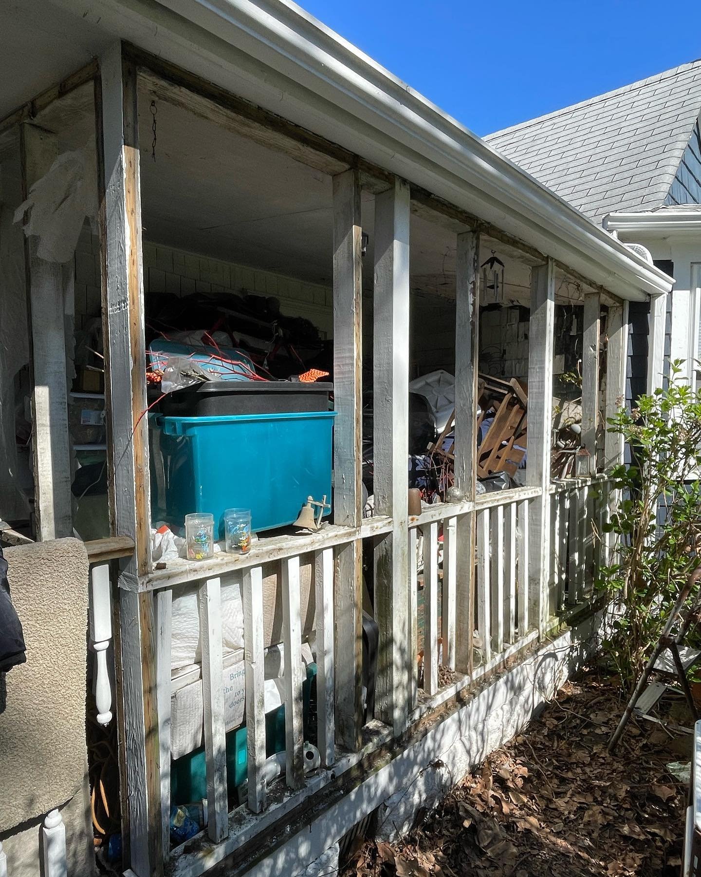 Before: the exterior porch openings with damaged and missing screening.