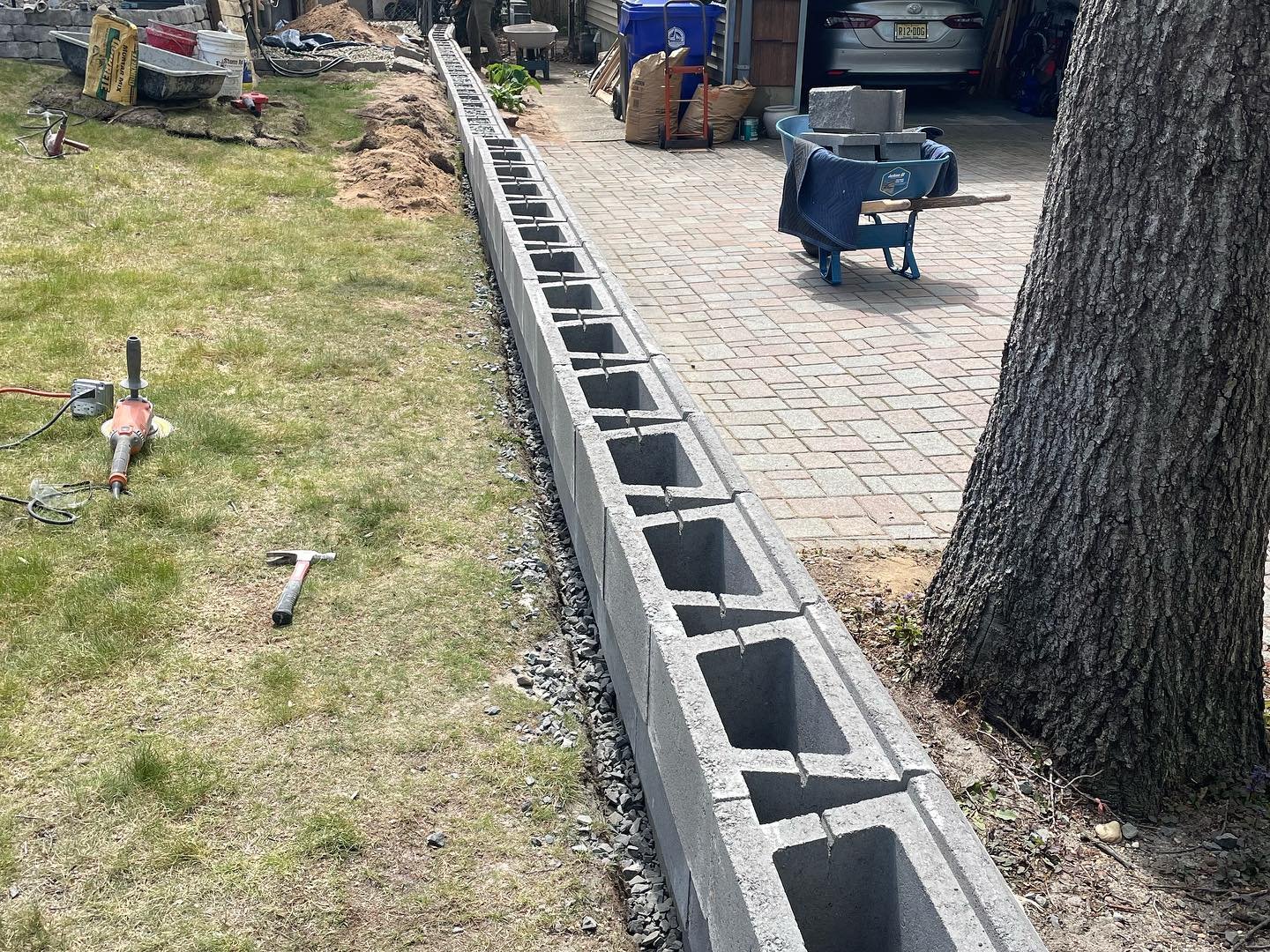 A view along the top of the wall during construction, showing the block alignment before capping.