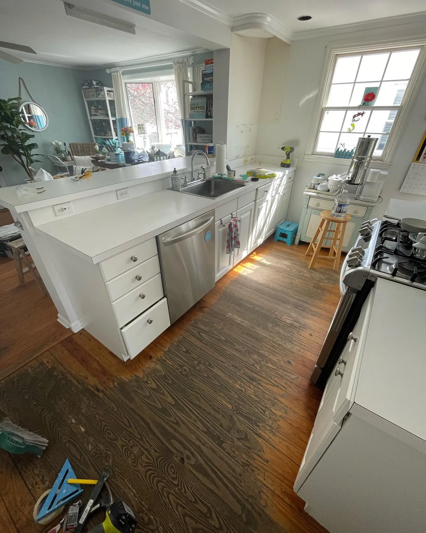 Before: the kitchen island with its existing countertop and the original wood floor.